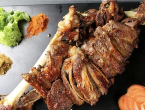 Roasted Lamb Leg on the Bone Beside Spices